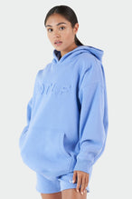 Girl Wearing Periwinkle Hoodie and Shorts